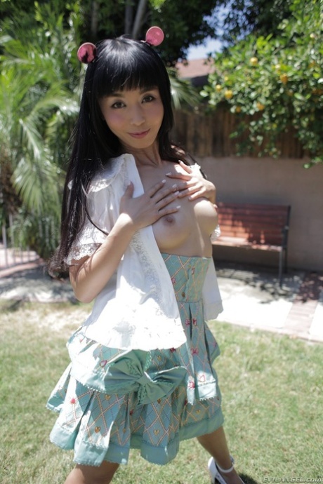 Japanese pornstar Marica Hase takes off her shirt and reveals tiny tits