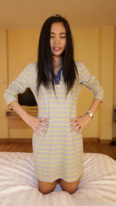 Pretty Asian babe Paw O shows off her beautiful tits and rides a big dick