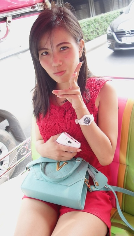 Sexy Asian Wan shows off her petite body while undressing for sex