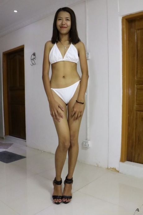 Sweet Asian skinny babe Angel F strips and gets pounded from behind