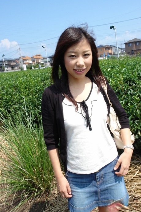 Japanese babe Karin Asahi reveals her big tits and hot pussy outdoors